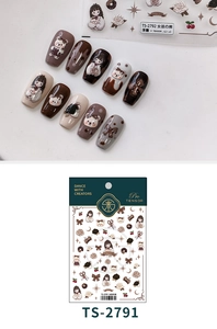 Close-up of 3D embossed nail stickers featuring mocha color bear and girl motifs