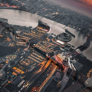 Close-up of cyberpunk city night print on fabric with detailed digital landmark textures