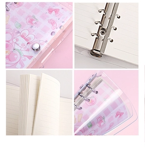 Detail of cute pink transparent PVC ring binder with cartoon patterns and silver rings