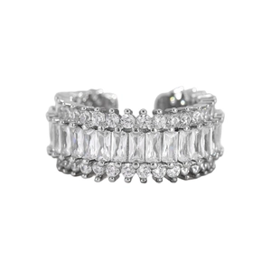 Macro detail of silver ring with three rows of baguette and round cut cubic zirconia