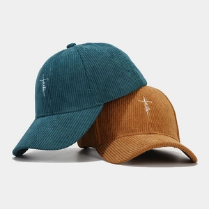 Corduroy baseball caps with faith embroidery in dark green and mustard yellow colors
