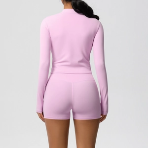 Detail view of double-sided brushed fabric on mauve yoga set with back fit shaping