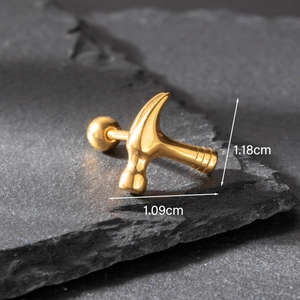 Detail of hammer shaped golden earring on slate with 1.18cm and 1.09cm dimensions