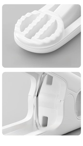 Detail of serrated grip surface and thick metal spring on durable white laundry clip