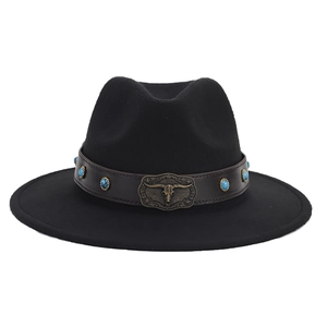 Detail of black fedora hat featuring a brown leather band with bull head metal buckle