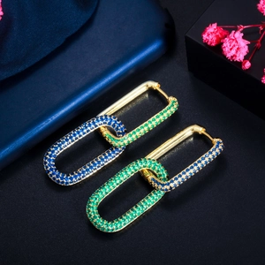 Detail of 18K gold-plated chain link earrings with micro-paved blue and green zircons