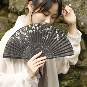 Chinese style folding fan with white plum blossom pattern and black bamboo frame