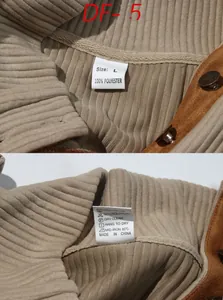 Close-up of khaki ribbed sweatshirt collar with brown suede trim and vintage snaps