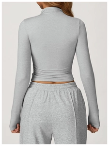 Rear view of grey long sleeve slim fit yoga top and matching drawstring sweatpants