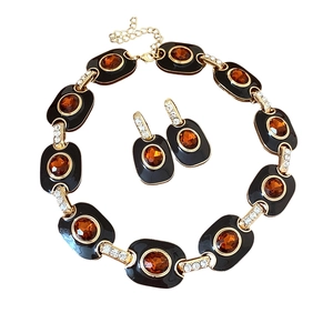 Vintage gold necklace and earring set with black enamel and amber stones