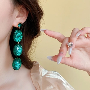 Vintage emerald green crystal triple-drop earrings with elegant gold plated finish