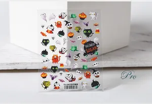 Close-up of 5D Halloween nail stickers with cartoon ghosts, pumpkins, and black cats