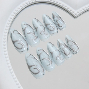Silver cat-eye press-on nails with grey flame pattern on heart-shaped mirror base