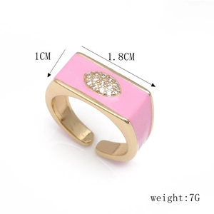 Detail shot of pink enamel evil eye ring showing dimensions 1.8cm width and 7g weight