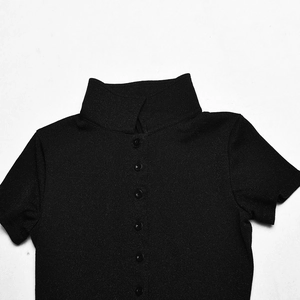 Close-up of black slim-fit romper featuring a mandarin collar and single-breasted button detail