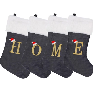 Set of 4 grey velvet Christmas stockings with white fur trim spelling HOME with gold letters