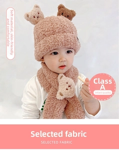 Close-up of cozy toddler bear hat and scarf set made of soft sherpa fleece fabric