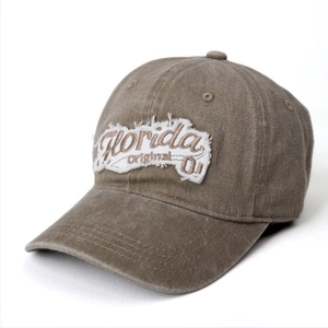 Detail of vintage washed canvas baseball cap with Florida Original embroidery and frayed edges