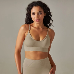 Detail view of seamless knitted yoga bra and leggings with ribbed compression waistband
