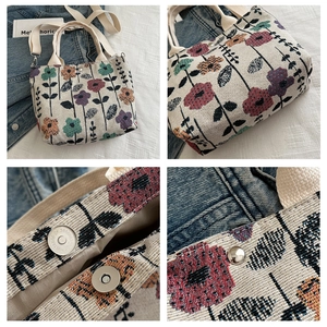 Detail view of floral canvas tote bag featuring magnetic closure and sturdy side snap buttons