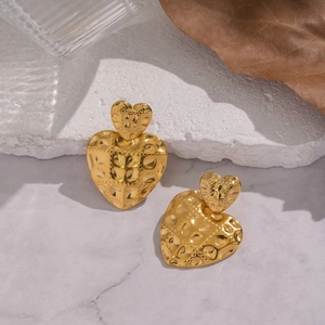 Vintage gold heart studs with hammered texture and small relief details for women