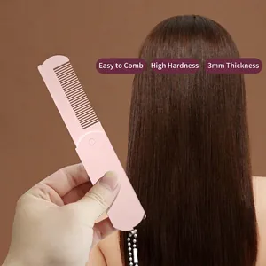 Pink foldable hair comb with 3mm thick teeth and hanging bead chain for portability