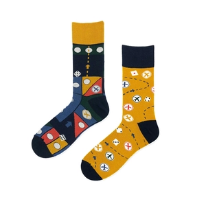 Flat lay of colorful cartoon jacquard cotton socks with mismatched patterns and dice motifs