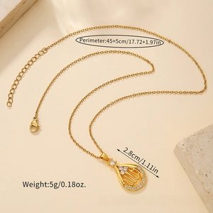 Detailed macro of gold Allah pendant necklace with zircons and 45+5cm adjustable chain