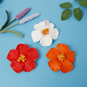 Three colorful 10cm artificial hibiscus flowers in red, white and orange on blue background