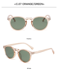 Detail view of retro round sunglasses with orange frames and green lenses, C.07 model