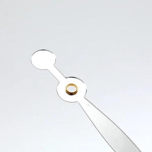 Minimalist silver metal quartz clock hands with brass bushing on light grey background