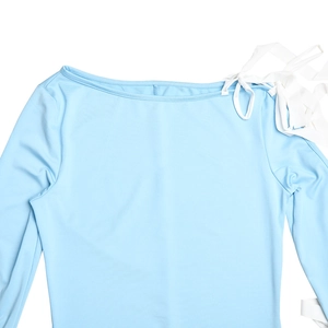 Detail of off-shoulder light blue dress featuring white tie-up shoulder straps and soft fabric