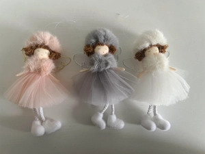 Detailed view of plush Christmas angel ornaments with gauze skirts in pink grey and white