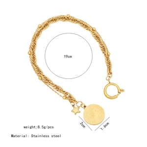 Detail of double-layer gold coin bracelet with Elizabeth II pendant and star charm