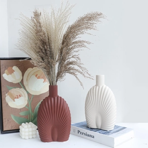 Nordic ceramic vase set in terracotta and matte white with ribbed texture and dried pampas