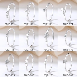 Collection of twelve S925 sterling silver minimalist rings with star and heart patterns