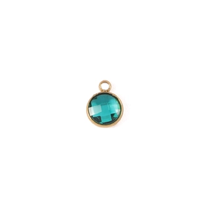 Detailed close-up of 7mm green birthstone pendant with round gold-plated metal frame