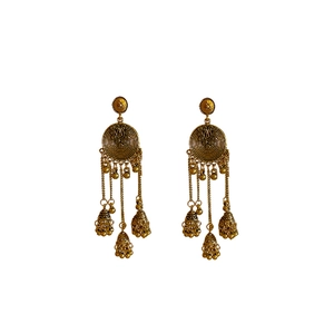 Vintage ethnic style golden round bell tassel earrings on a clean white background