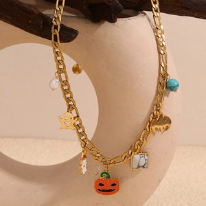 Halloween charm necklace with gold ghost and pumpkin pendants on 18K plated Figaro chain