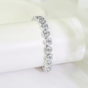Romantic heart-shaped 3A zircon tennis bracelet in gold-plated copper on white display