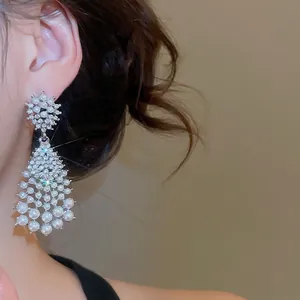 Elegant silver drop earrings featuring radiant rhinestones and tiered white pearls