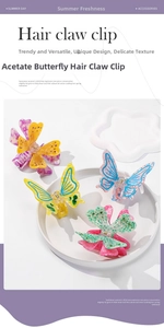 Detail of multi-color acetate butterfly hair claw clips with sparkling rhinestone accents