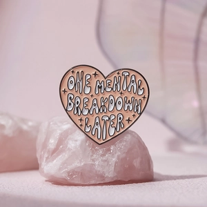 Pink heart enamel pin with One Mental Breakdown Later slogan for bags and clothes