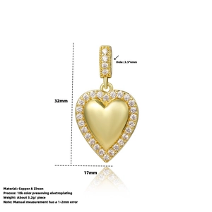 Detailed view of gold heart pendant with zircon inlay and 18k plating 32mm size