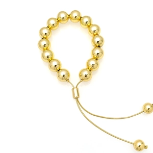 Adjustable 18k gold-plated bead bracelet detail with sliding buckle and smooth metallic finish