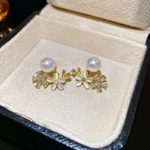 Floral cat-eye stone earrings with pearls and crystals in a jewelry box setting