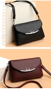 Detail showing elegant litchi grain texture on black and burgundy faux leather bags