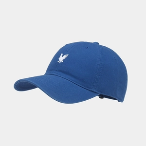 Detailed view of navy cotton baseball cap featuring white eagle embroidery and stitched eyelets