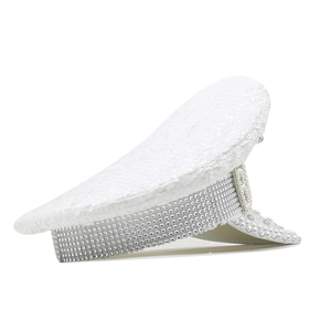 Detail of white sequins and silver rhinestones on a decorative captain hat with pearls