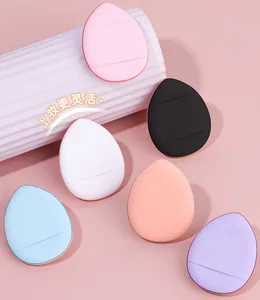 Detailed view of six colorful mini finger puffs with straps for flexible makeup application